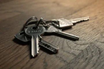 House keys on a wooden table after closing on a home in Quintana Roo, Mexico