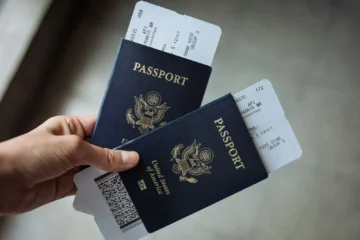 Two passports held together, representing Mexican residency through family ties