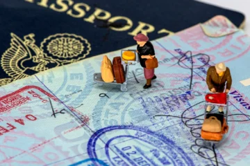 A passport with a visa stamp, representing a Mexican work visa and permit for foreigners