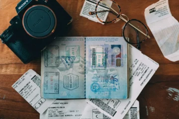 A passport with entry stamps, representing regularizing an expired immigration status in Mexico